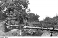 Солдаты Вермахта с пулеметом MG-34. Франция, 1944 г.